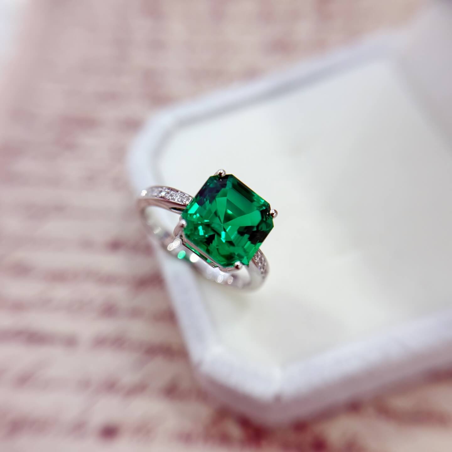 Asscher cut lab grown emerald engagement ring