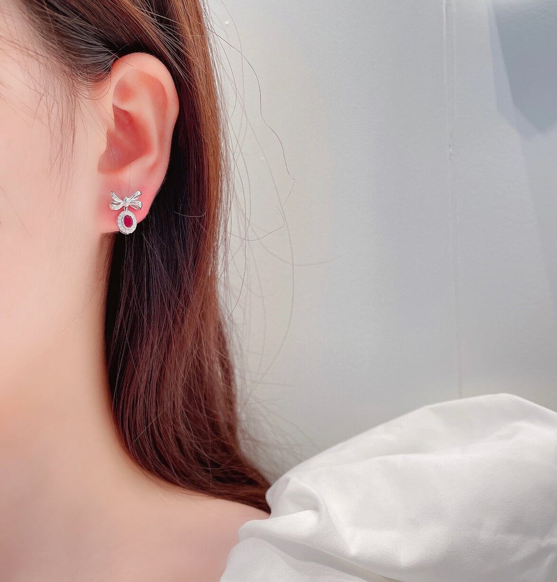 Bow design oval cut lab grown ruby earrings stud