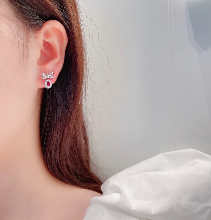 Bow design oval cut lab grown ruby earrings stud
