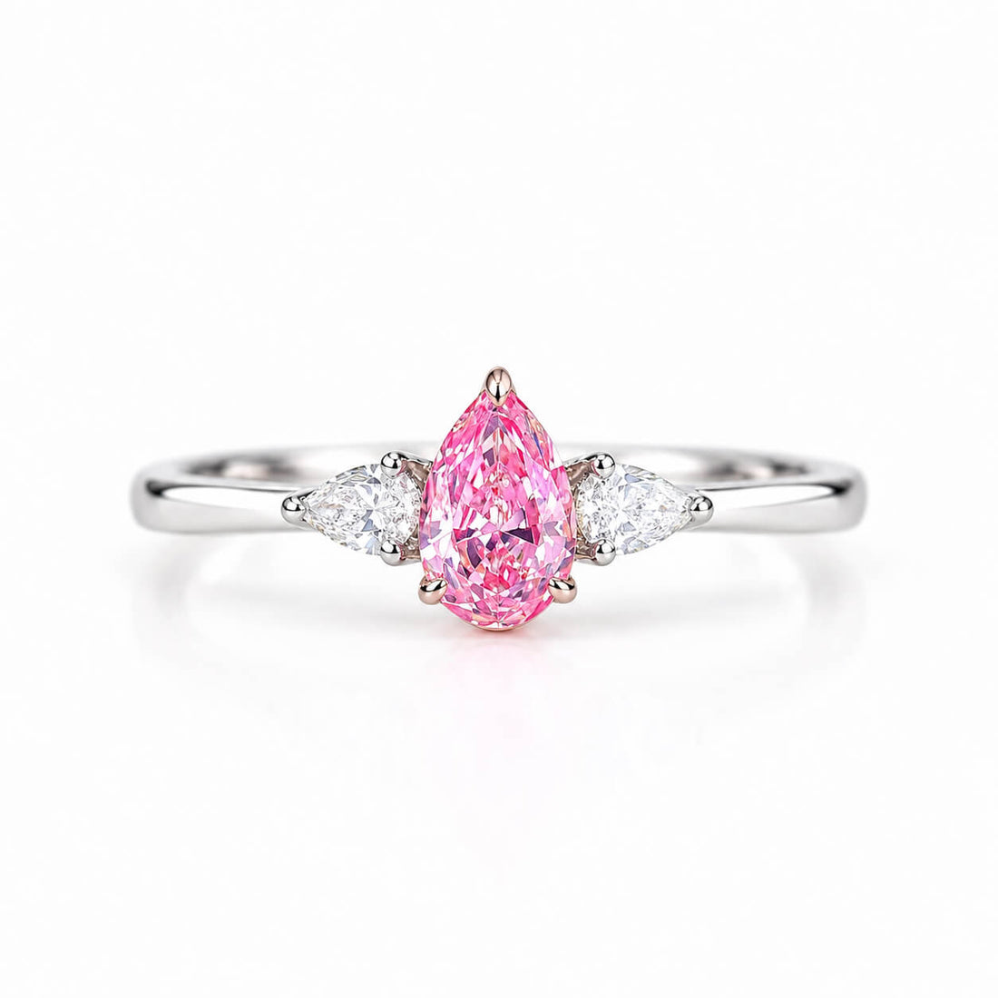 Pear cut lab grown pink diamond three stones engagement ring