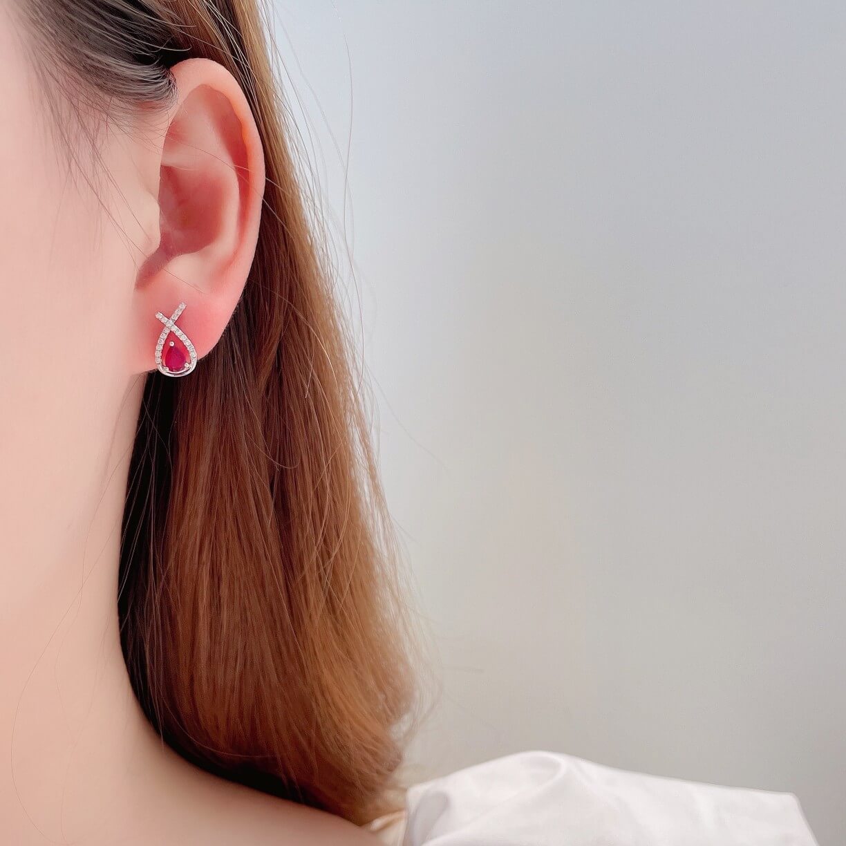Cross-cut design pear cut lab grown ruby earrings stud