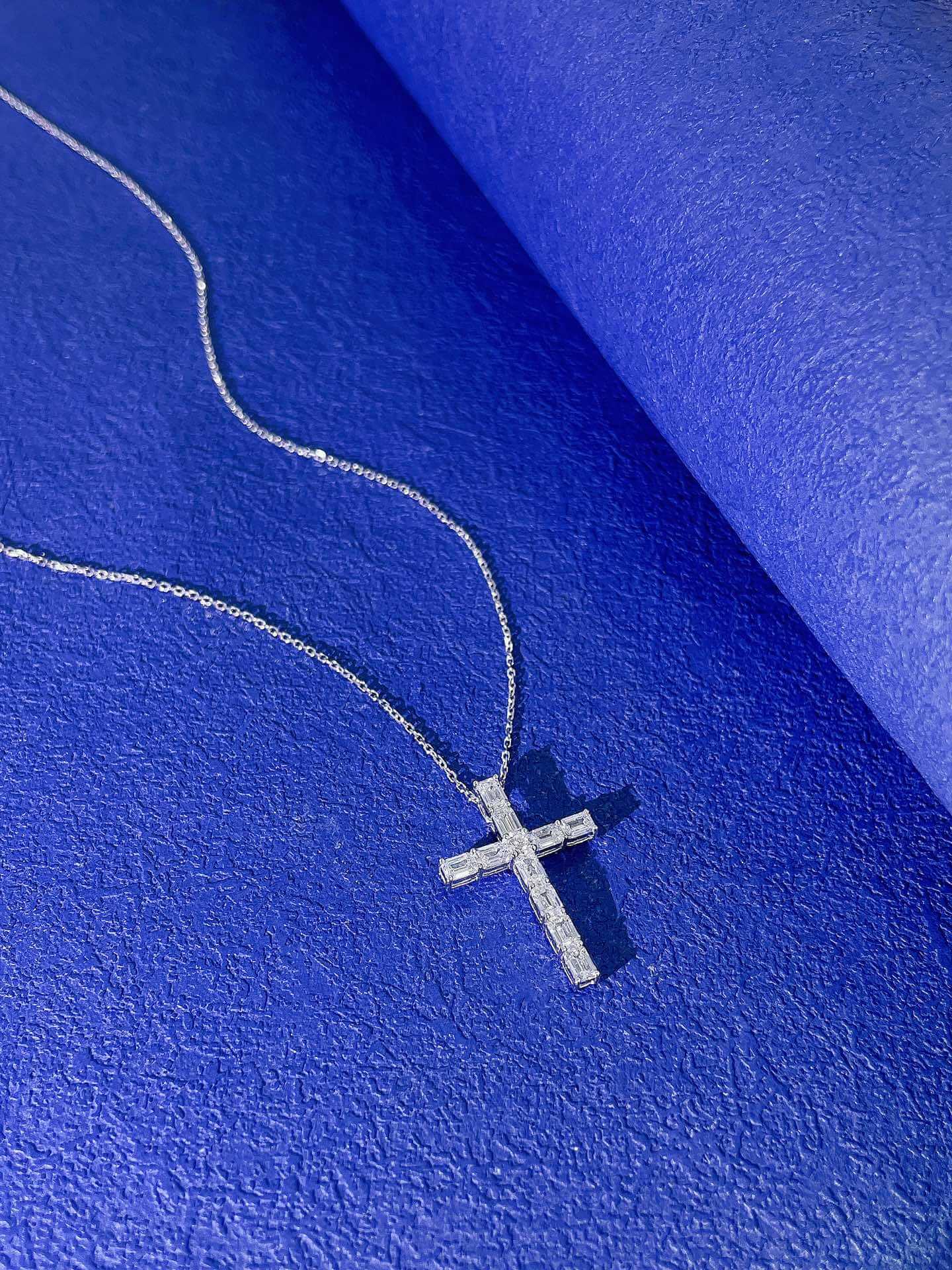 Emerald cut lab grown diamond cross pendant necklace