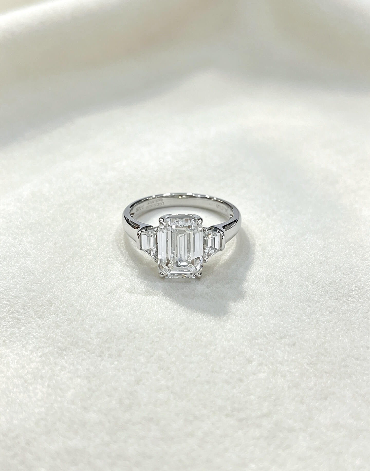 Emerald cut lab grown diamond three stones engagement ring