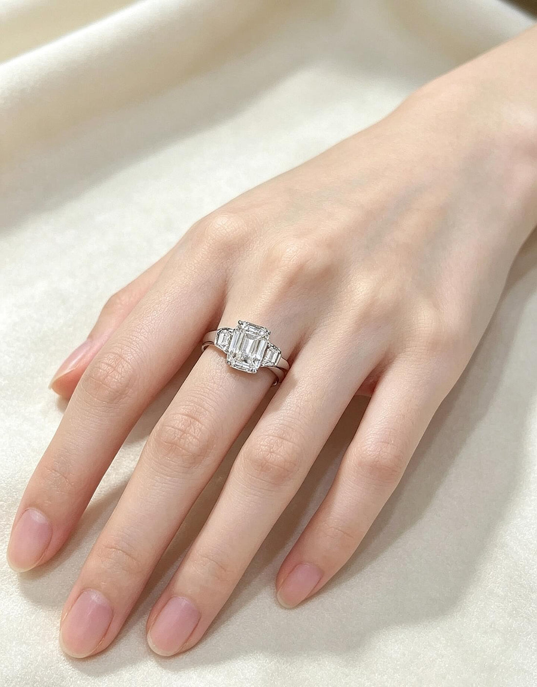 Emerald cut lab grown diamond three stones engagement ring