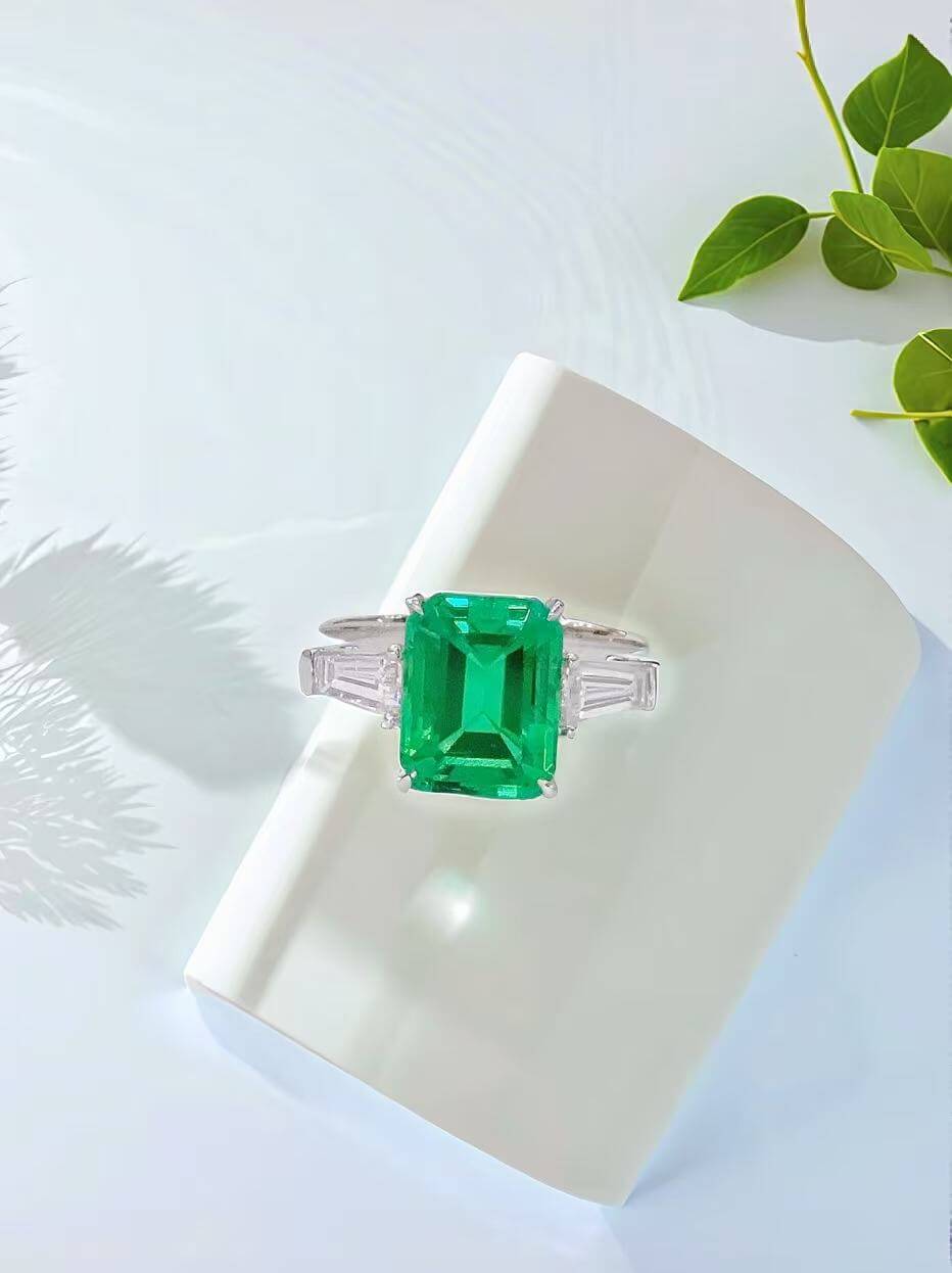 Emerald cut lab grown emerald three stones engagement ring