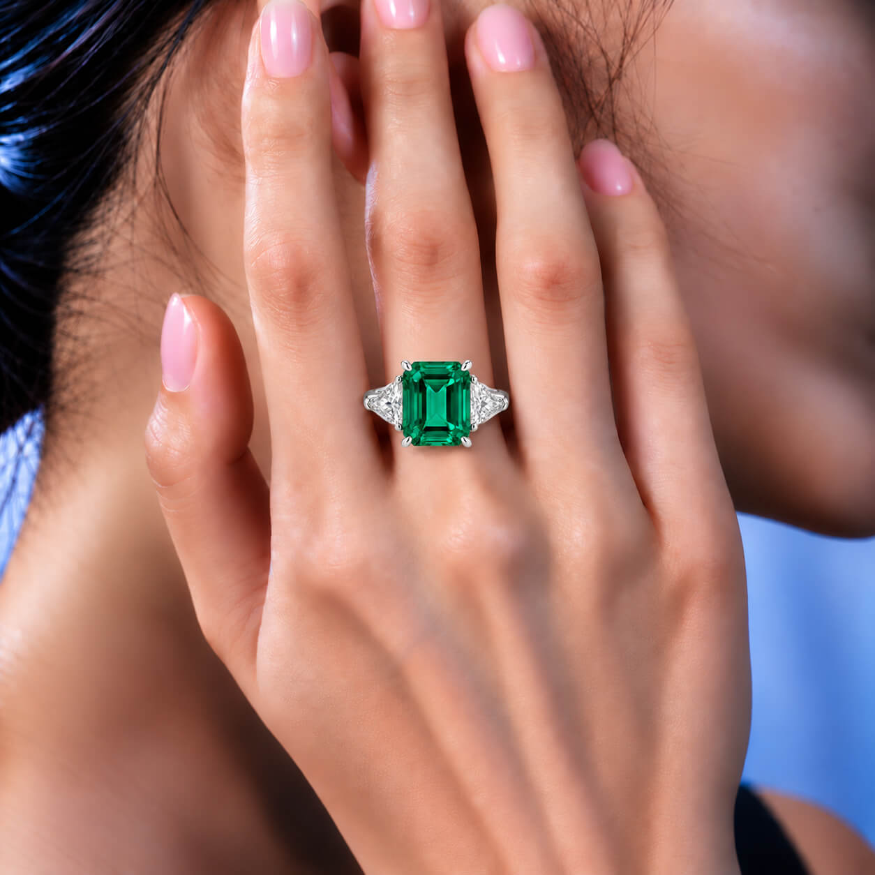 Emerald cut lab grown emerald three stones engagement ring