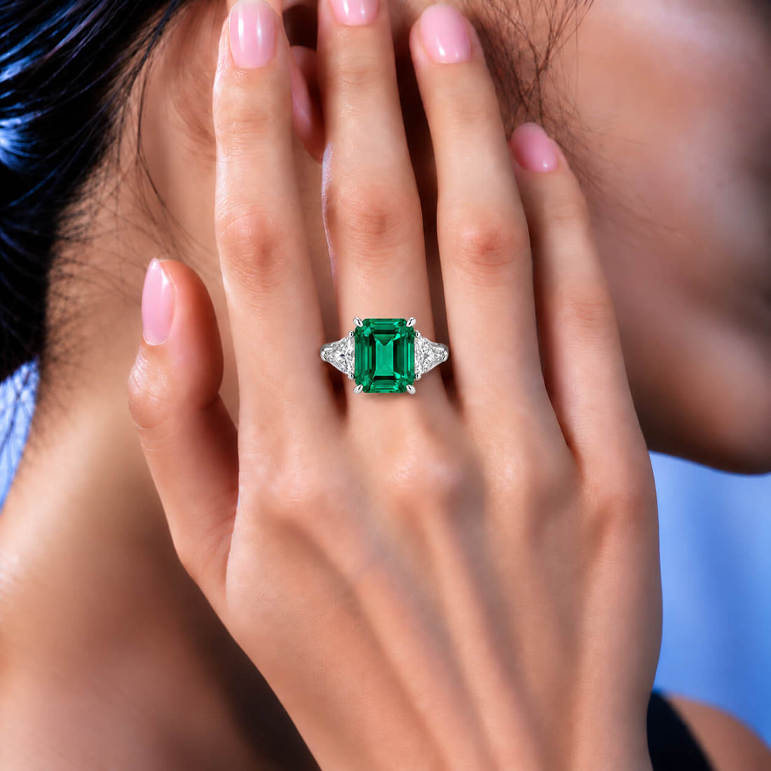 Emerald cut lab grown emerald three stones engagement ring
