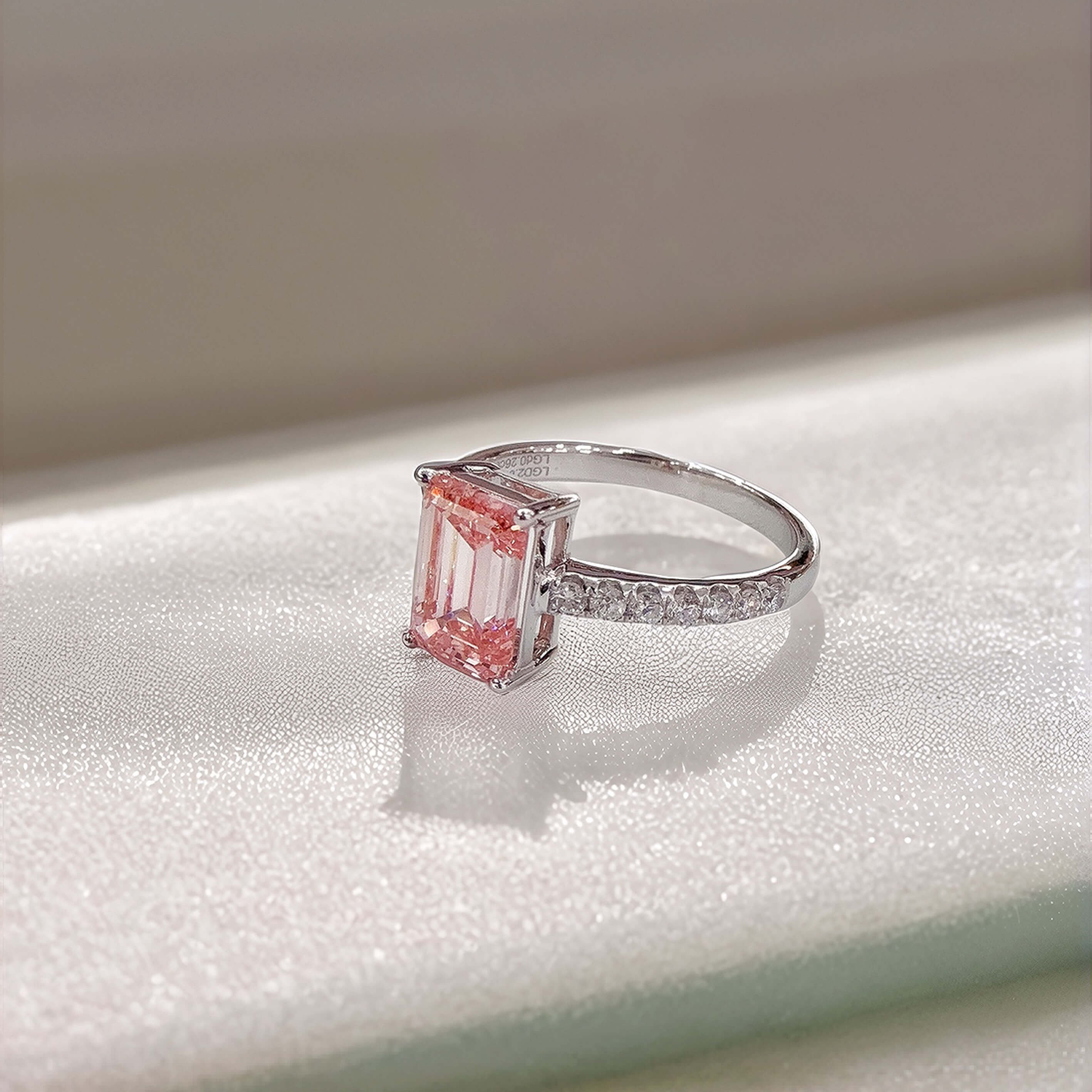 Emerald cut lab grown pink diamond engagement ring
