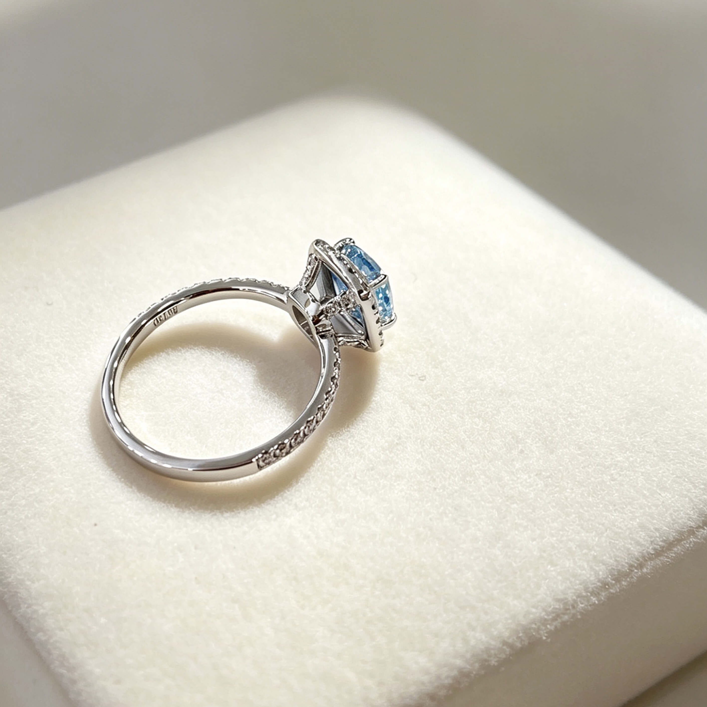 Halo setting cushion cut lab grown blue diamond engagement ring