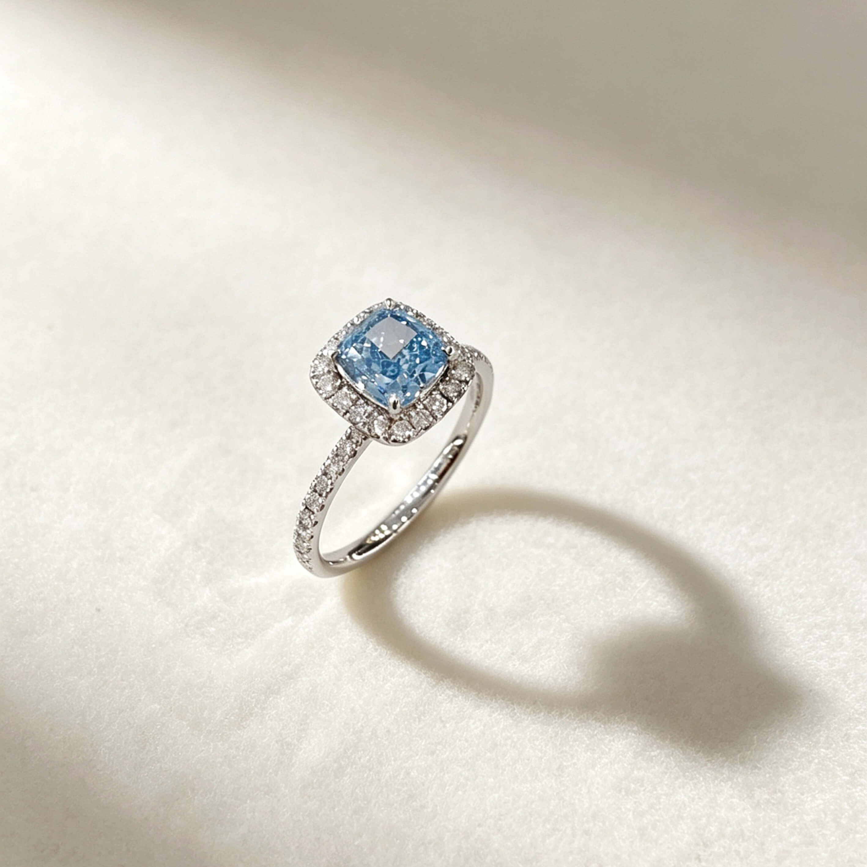 Halo setting cushion cut lab grown blue diamond engagement ring