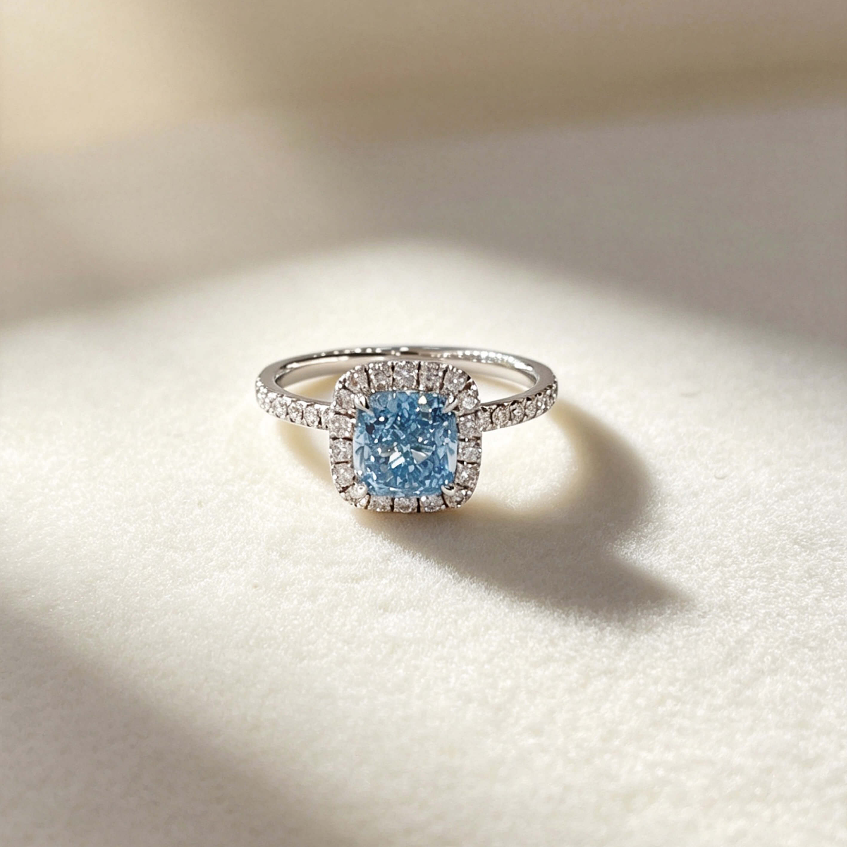 Halo setting cushion cut lab grown blue diamond engagement ring