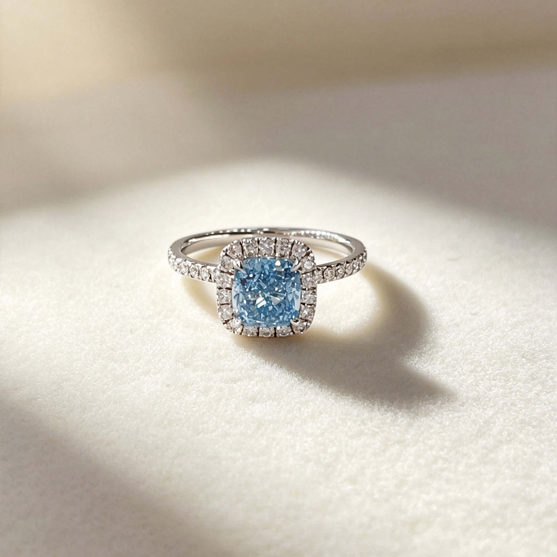 Halo setting cushion cut lab grown blue diamond engagement ring