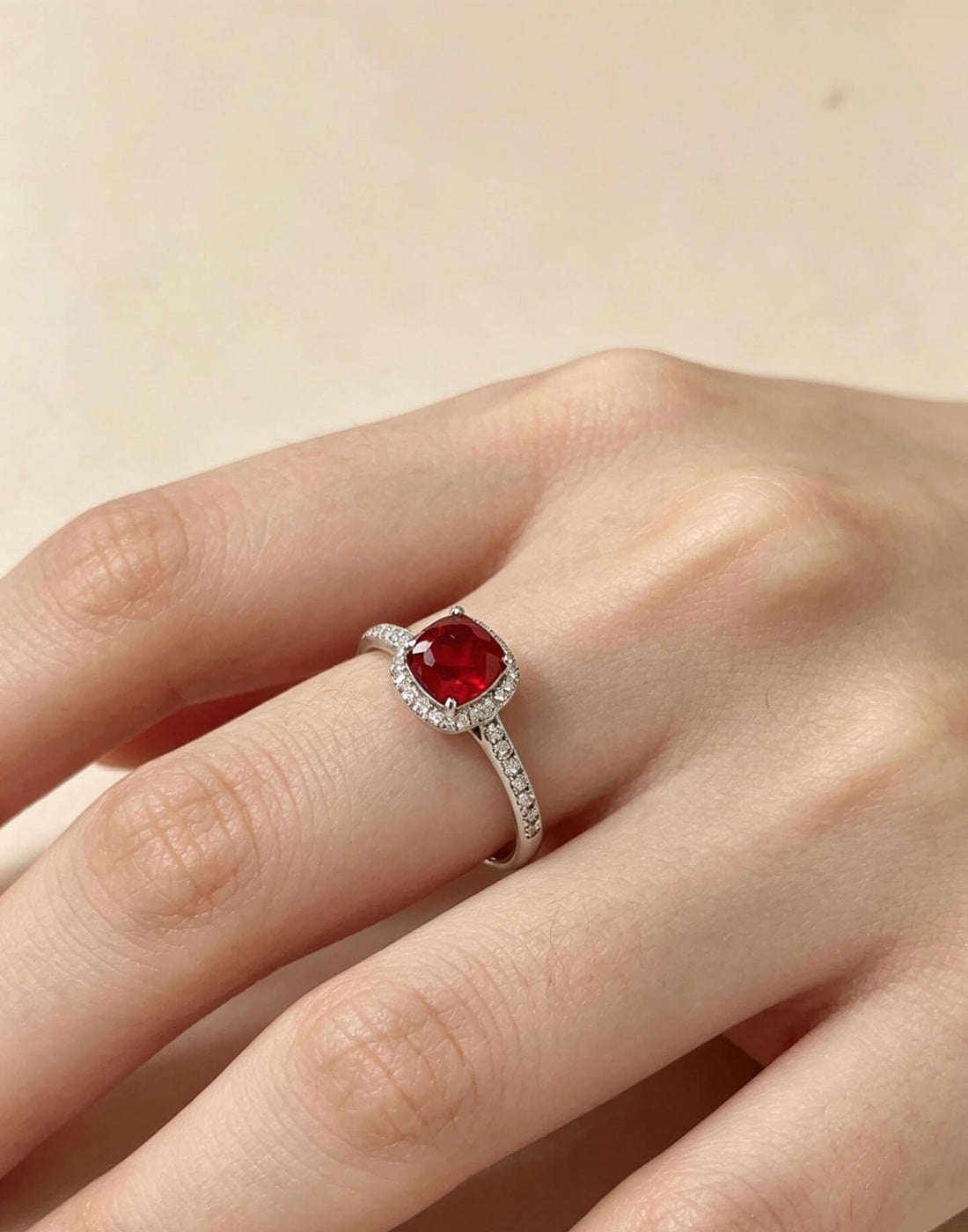 Halo setting cushion cut lab grown ruby engagement ring