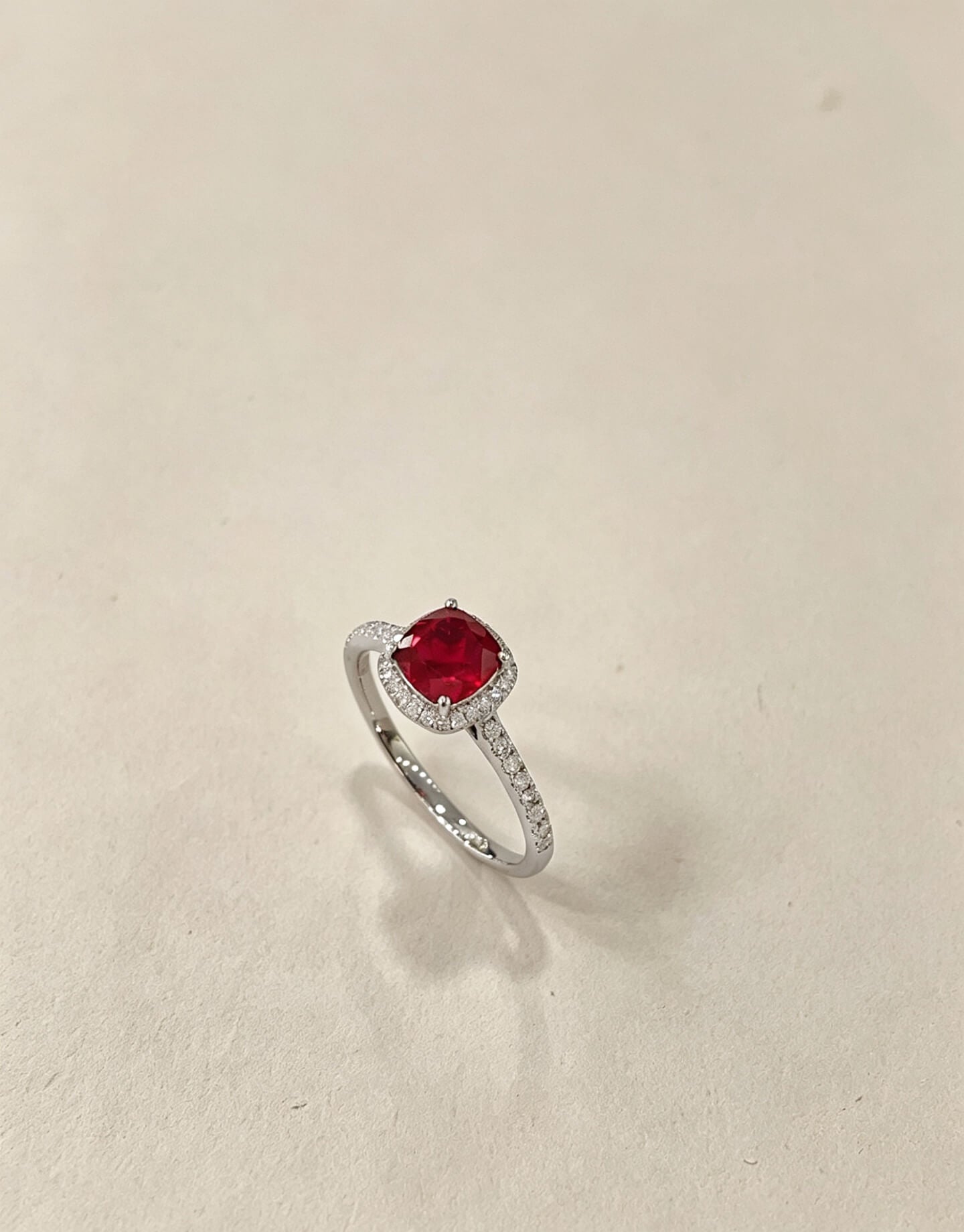 Halo setting cushion cut lab grown ruby engagement ring