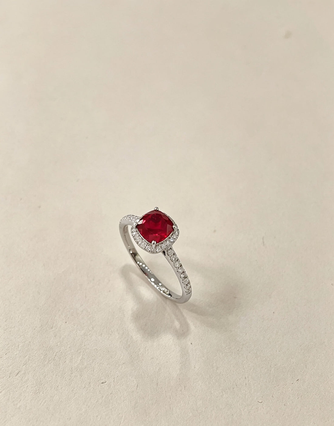 Halo setting cushion cut lab grown ruby engagement ring