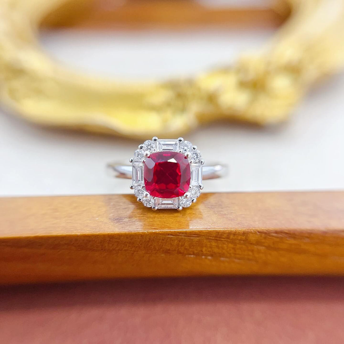 Halo setting cushion cut lab grown ruby engagement ring
