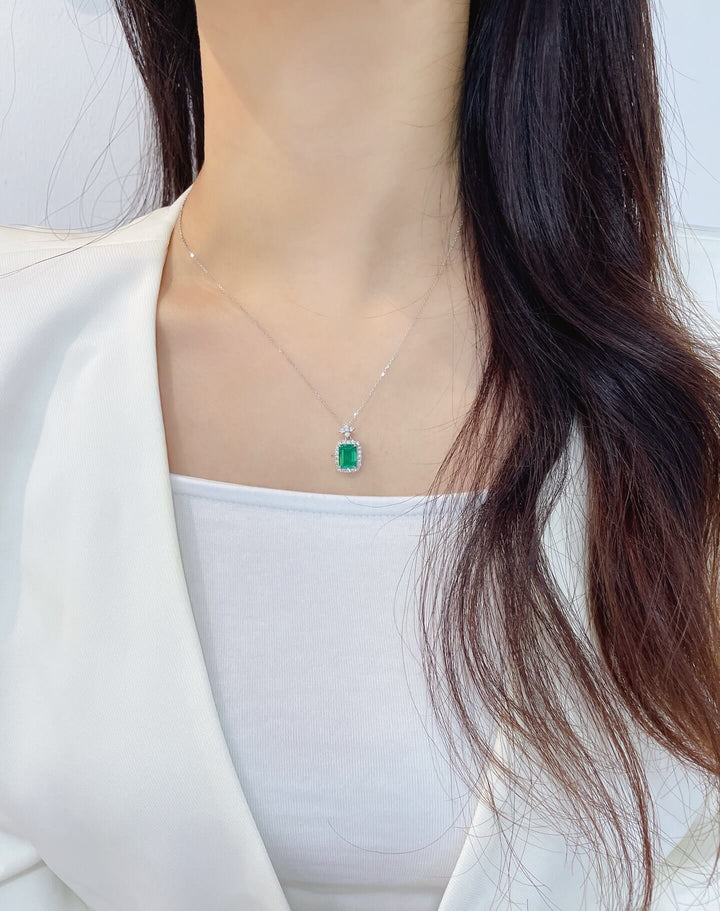Halo setting emerald cut lab grown emerald pendant necklace