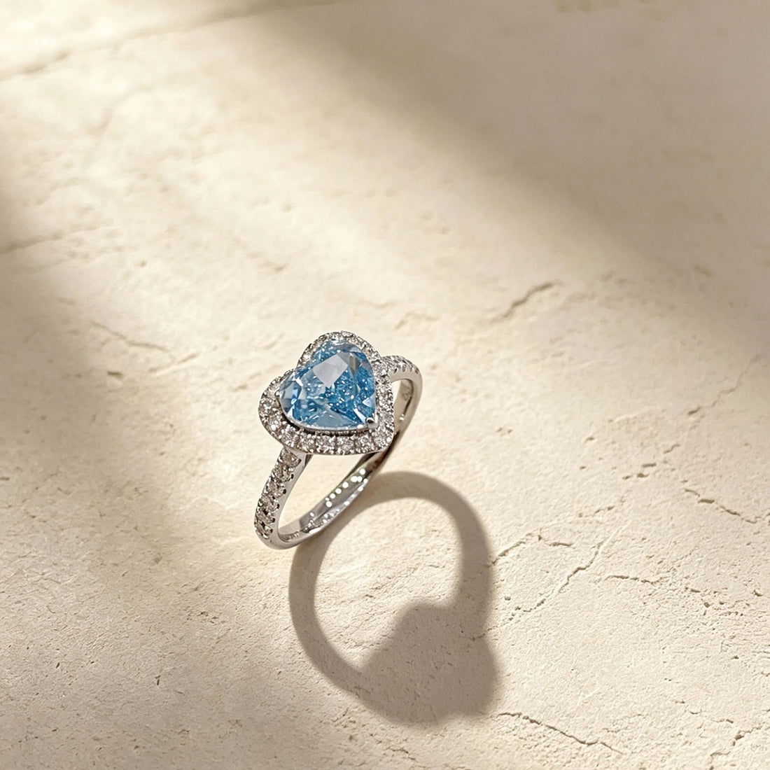 Halo setting heart cut lab grown blue diamond engagement ring