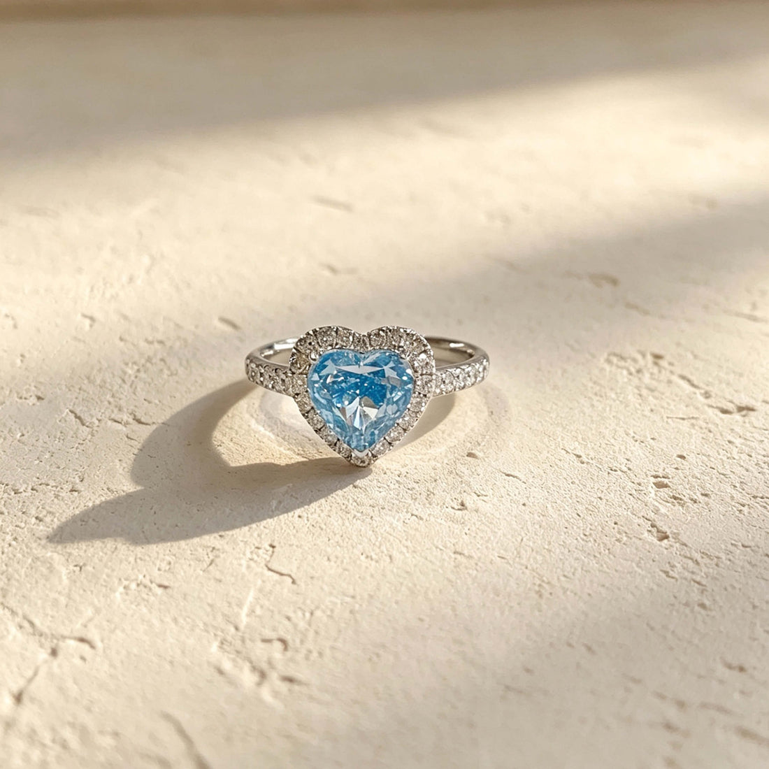 Halo setting heart cut lab grown blue diamond engagement ring