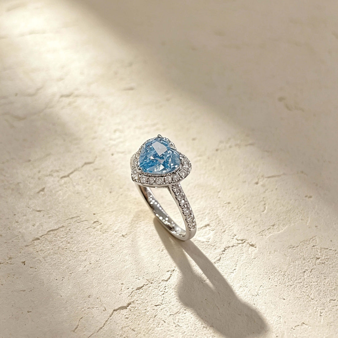 Halo setting heart cut lab grown blue diamond engagement ring