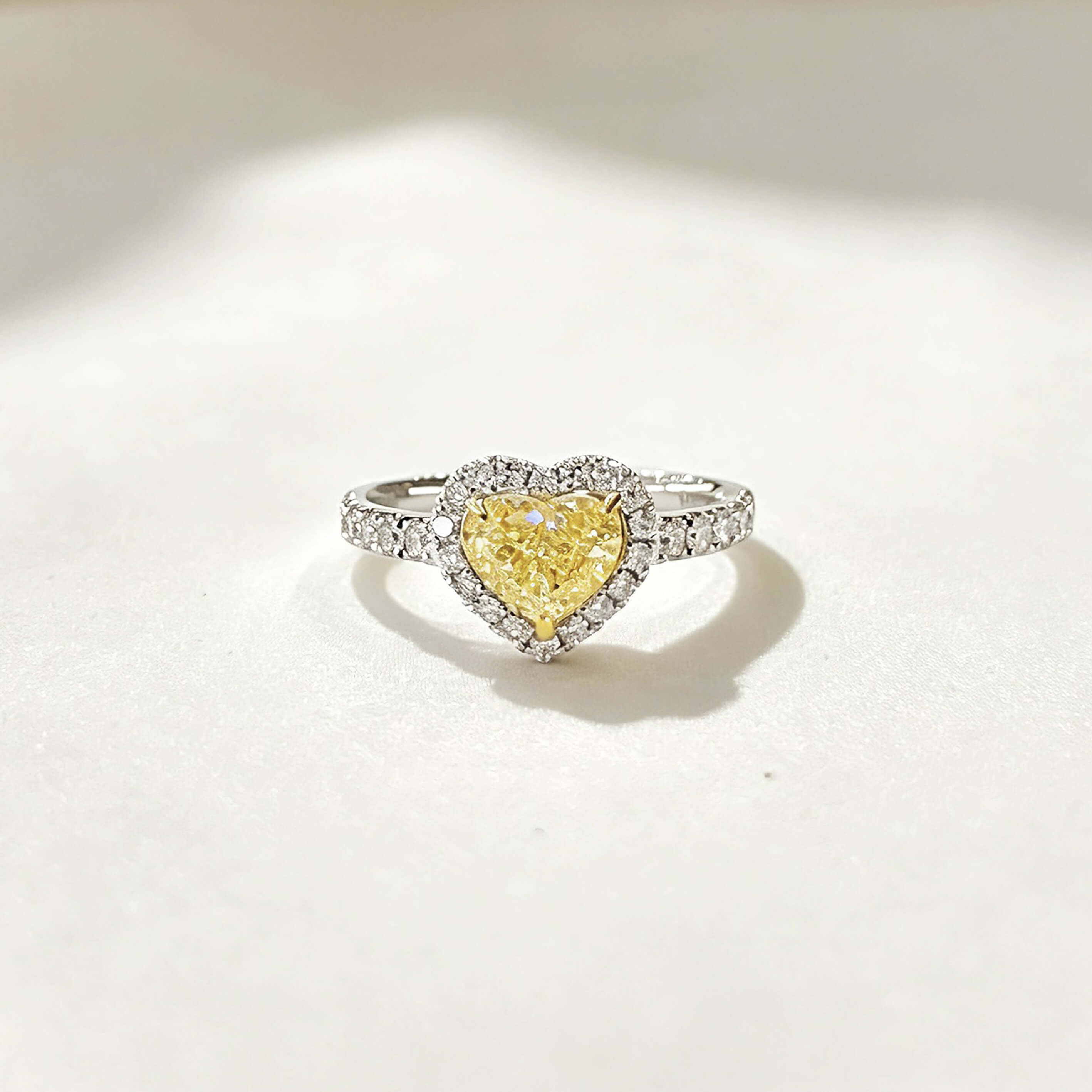 Halo setting heart cut lab grown yellow diamond engagement ring