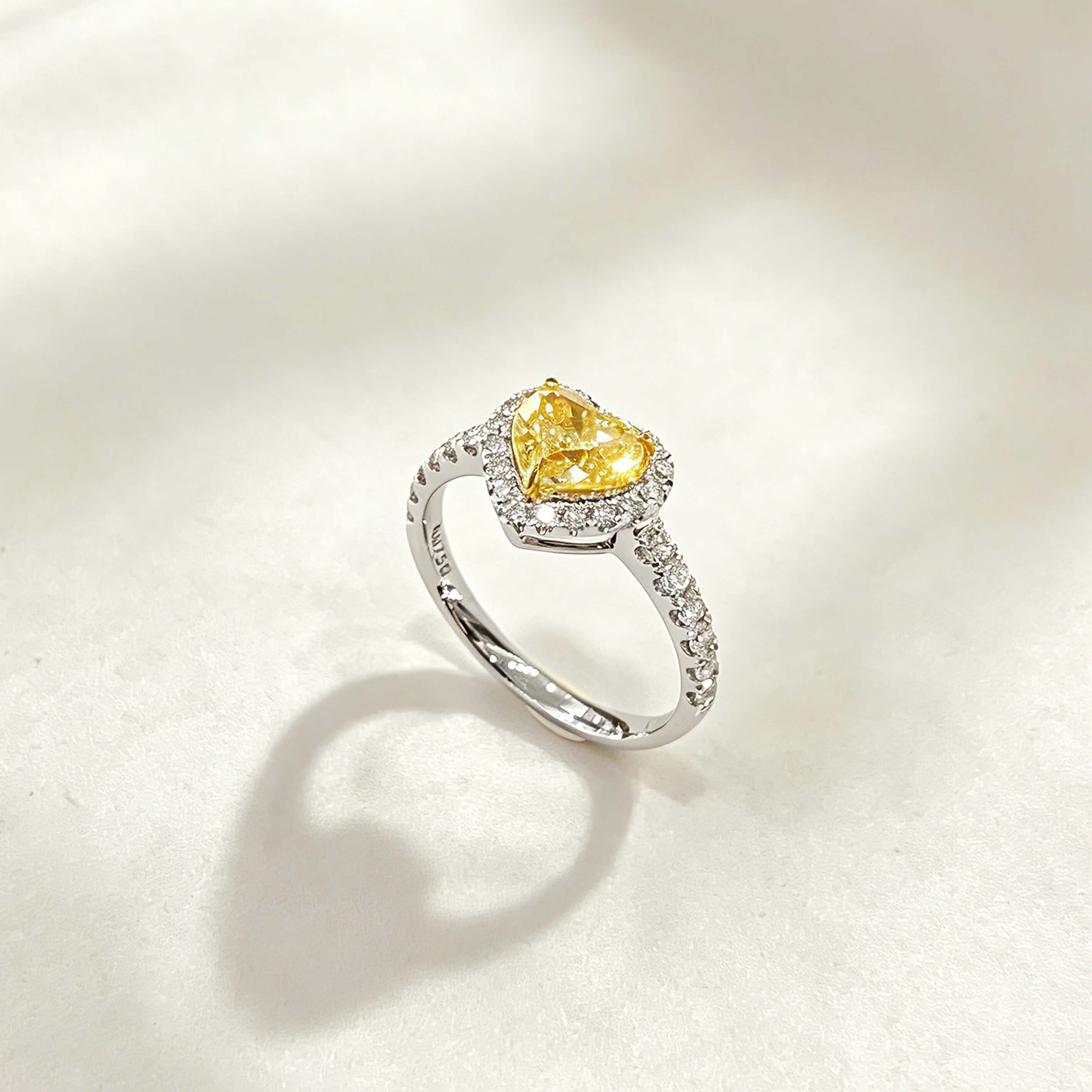 Halo setting heart cut lab grown yellow diamond engagement ring