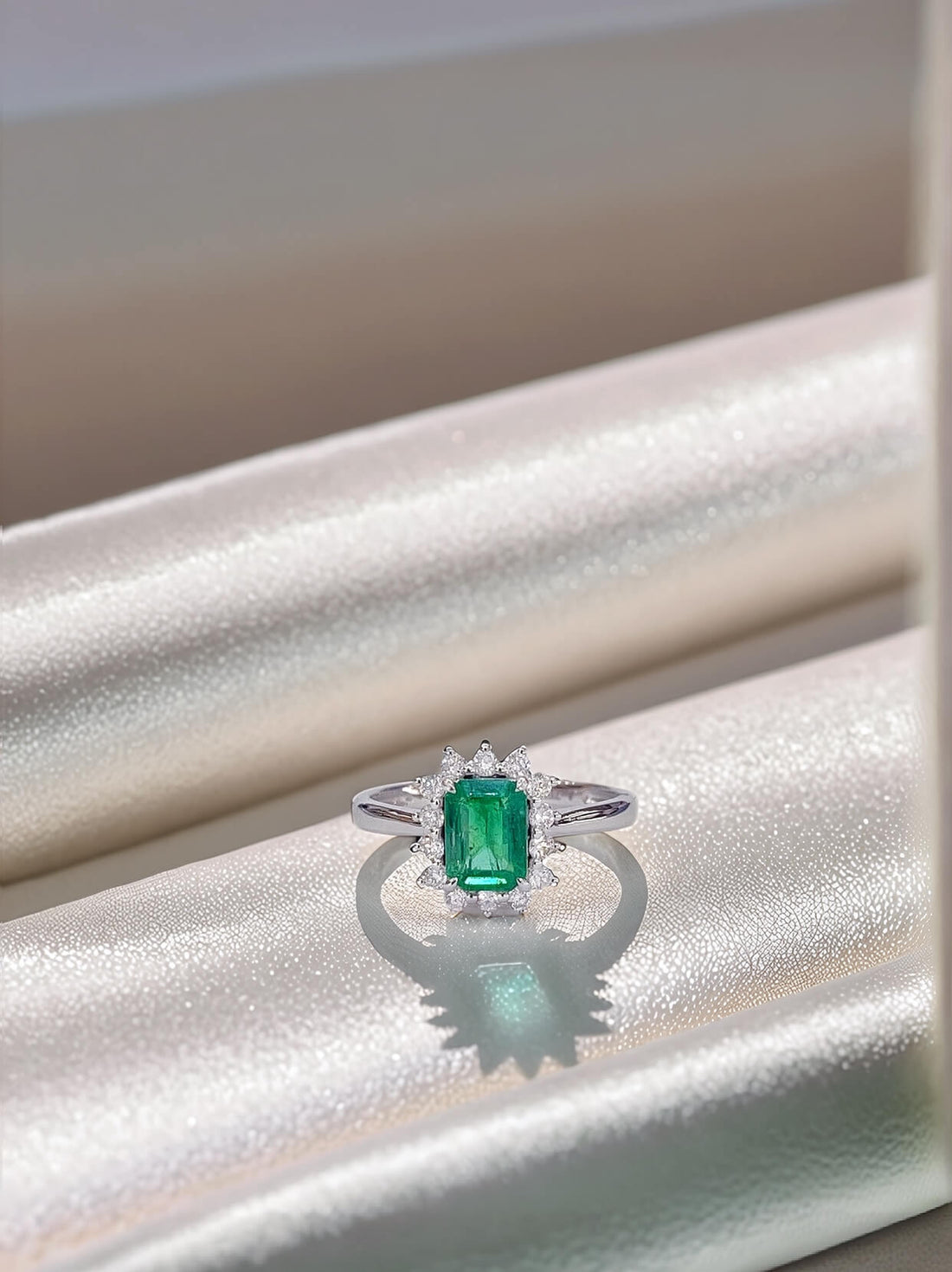 Halo setting lab grown emerald engagement ring