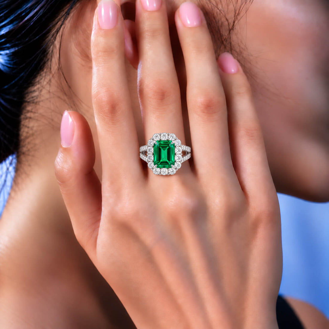 Halo setting lab grown emerald engagement ring