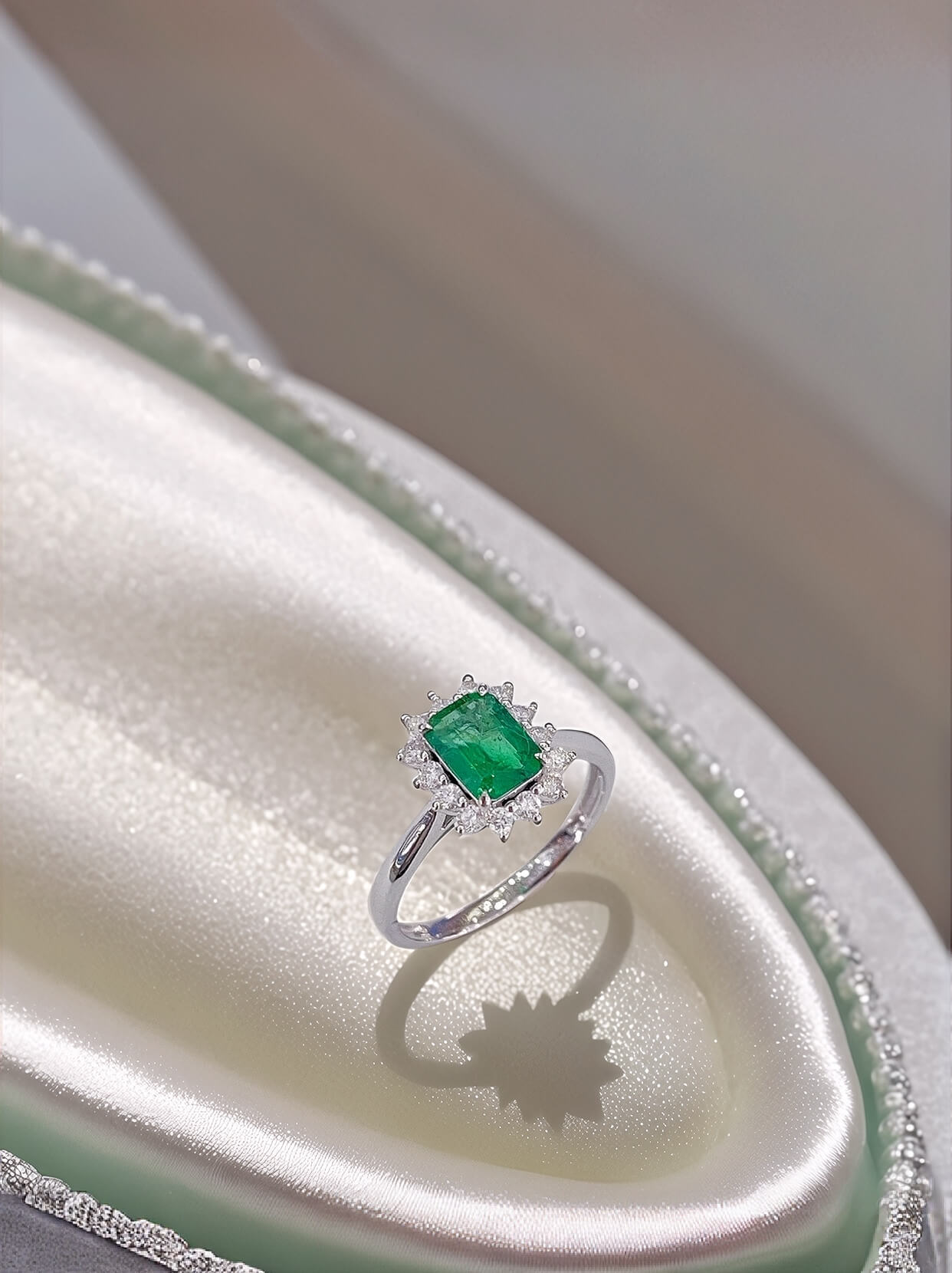 Halo setting lab grown emerald engagement ring