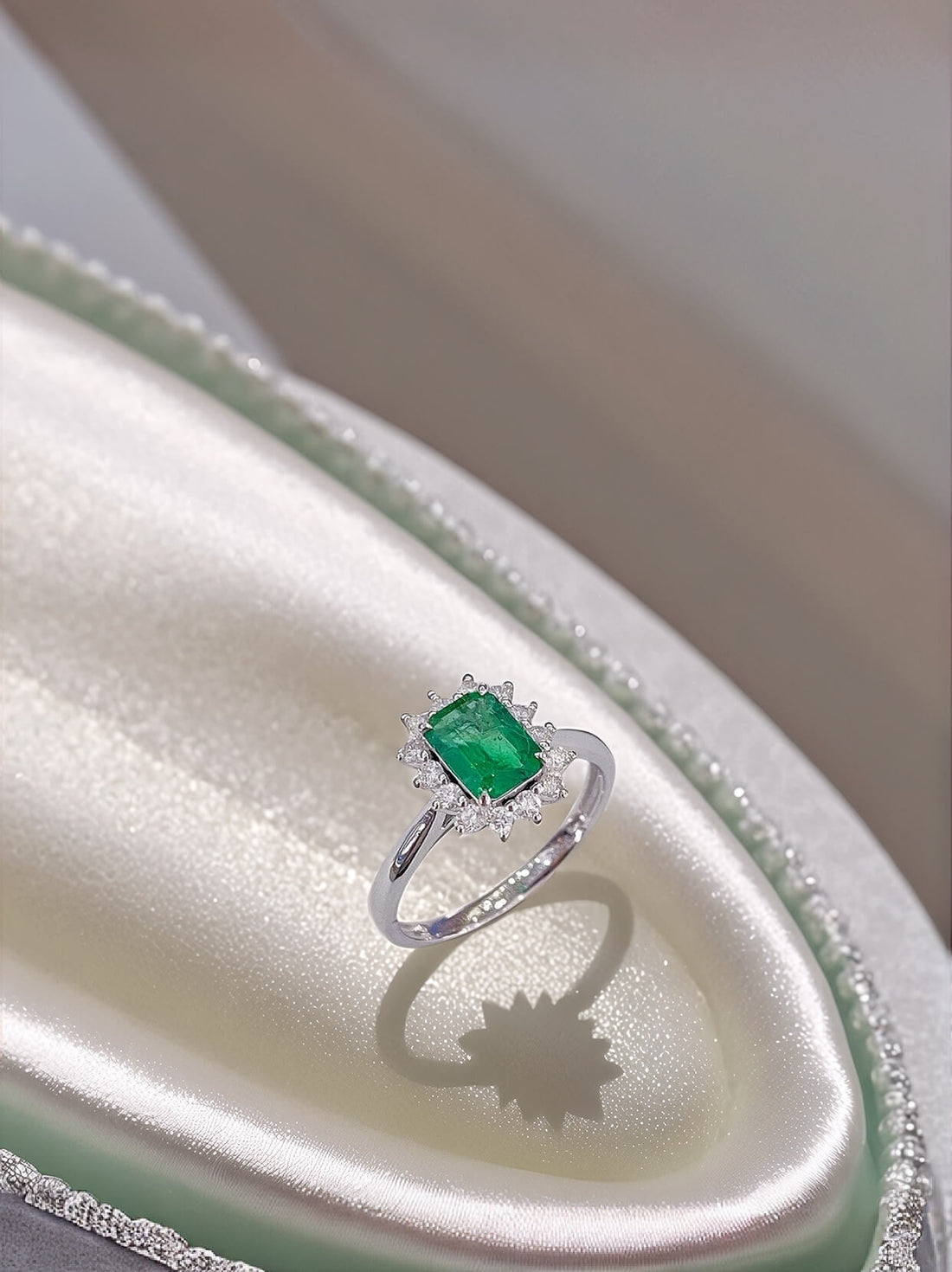 Halo setting lab grown emerald engagement ring