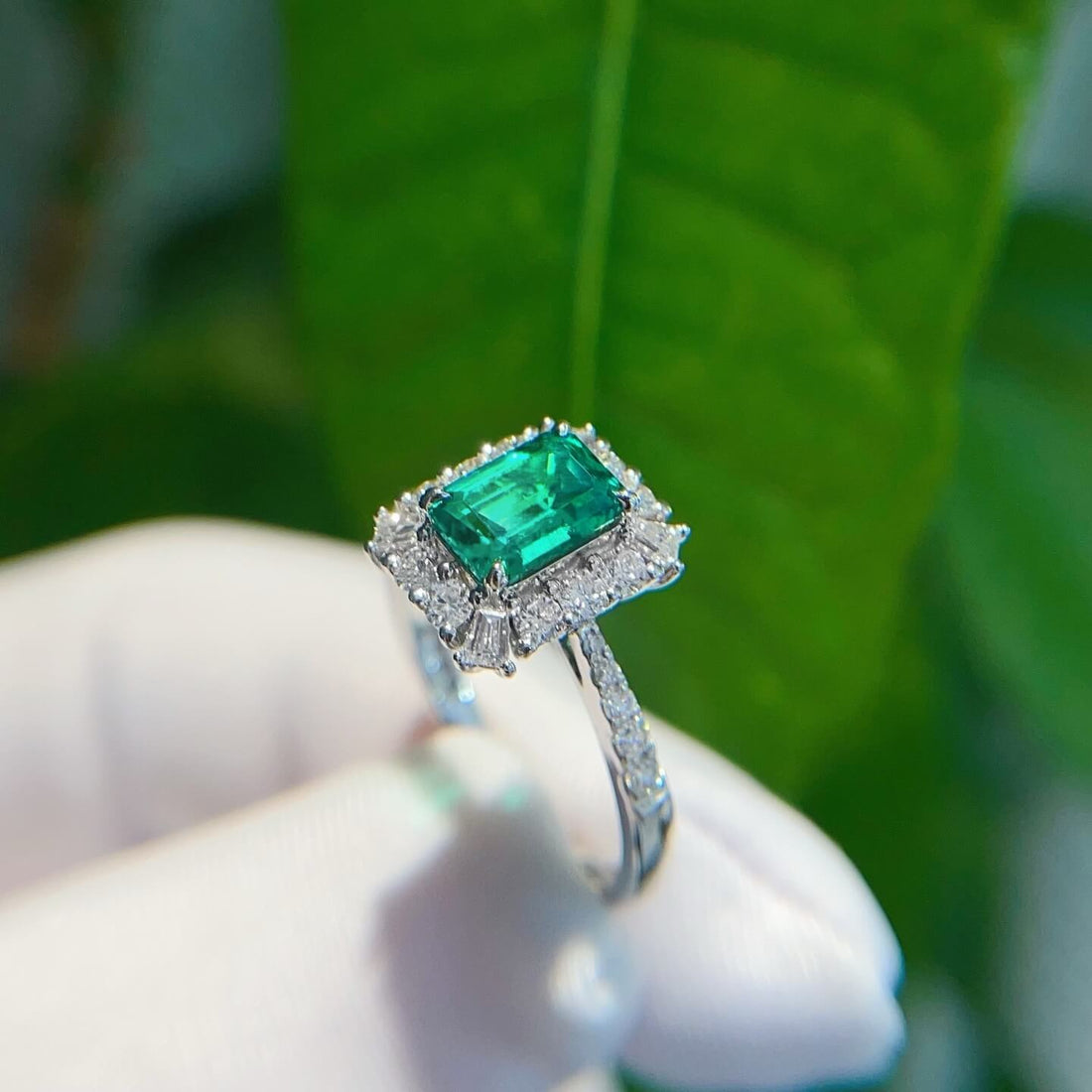 Halo setting lab grown emerald engagement ring