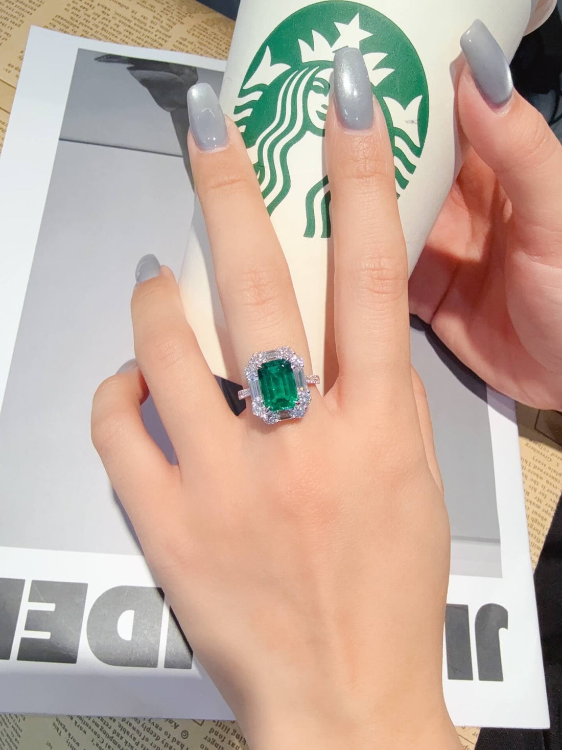 Halo setting lab grown emerald engagement ring