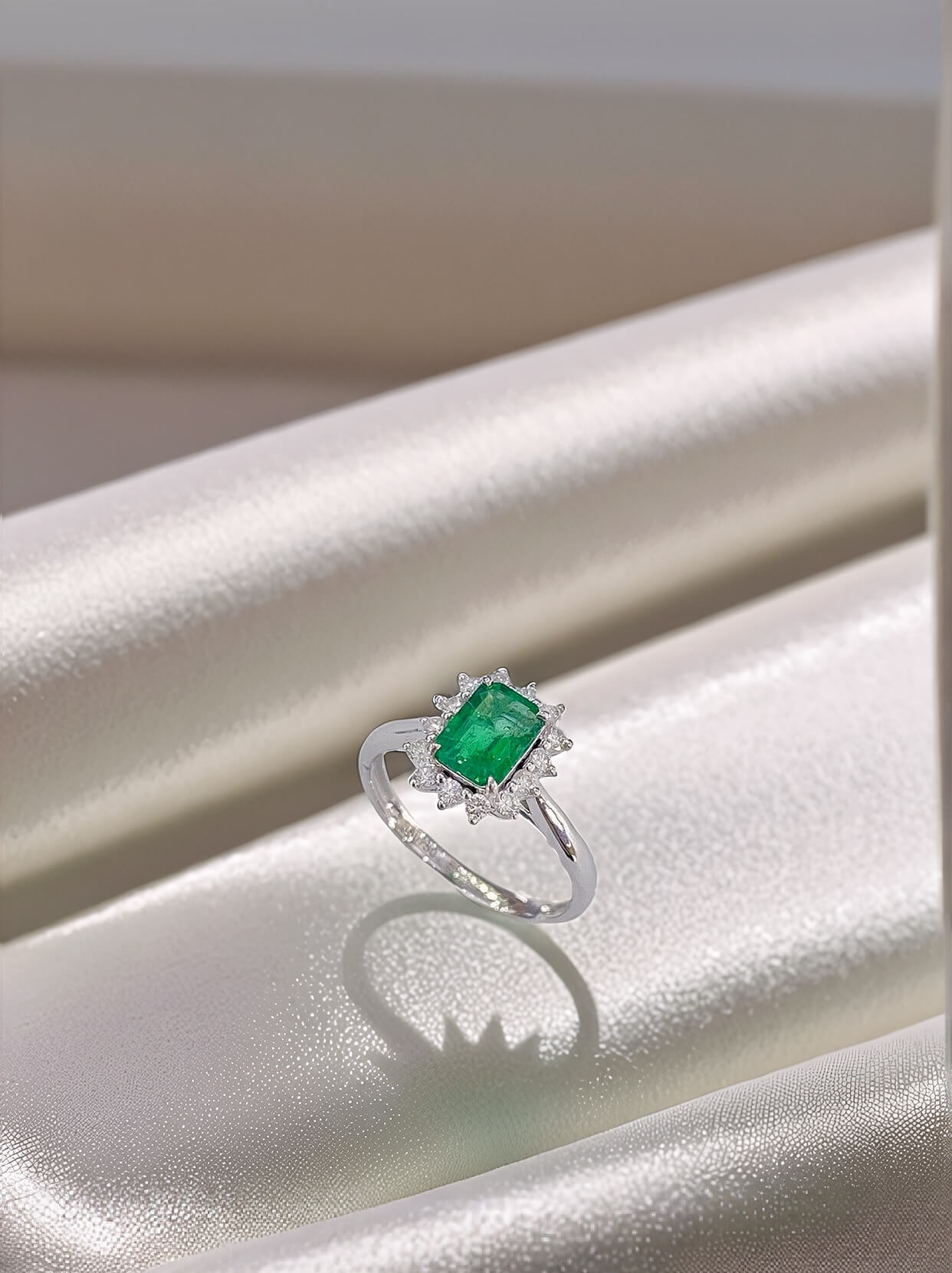 Halo setting lab grown emerald engagement ring