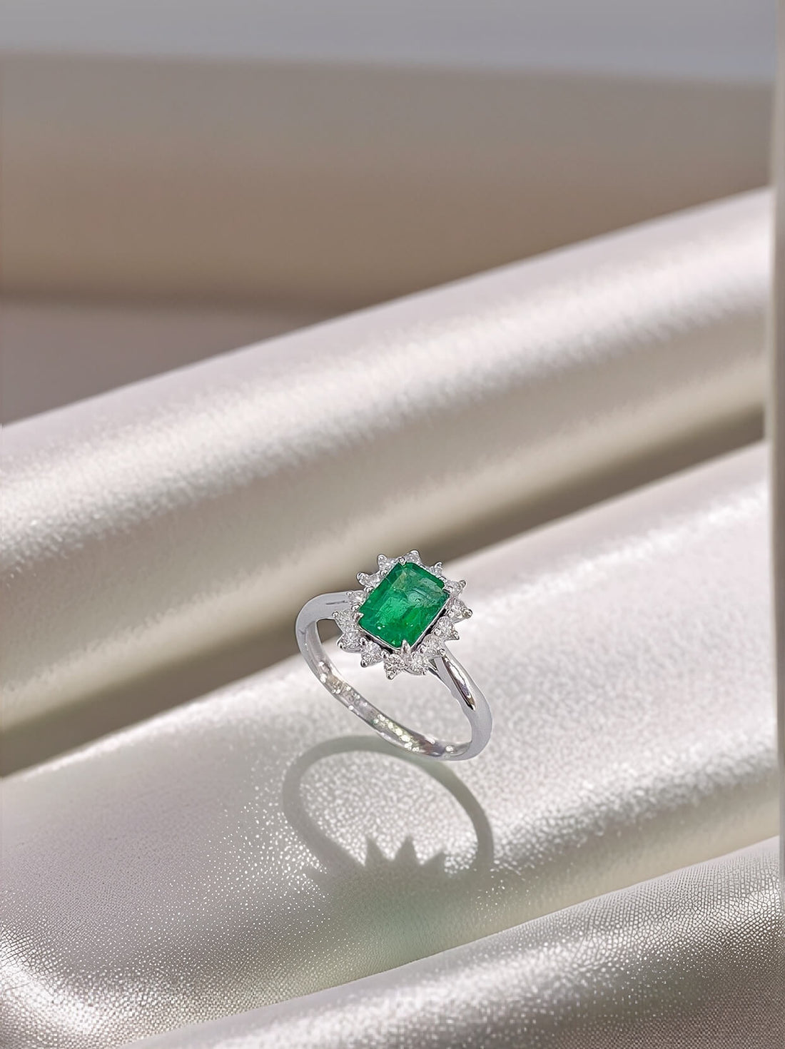 Halo setting lab grown emerald engagement ring