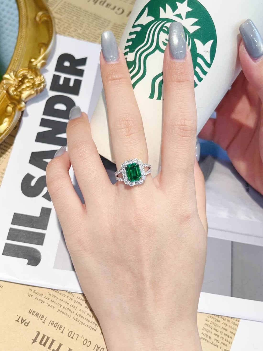 Halo setting lab grown emerald engagement ring