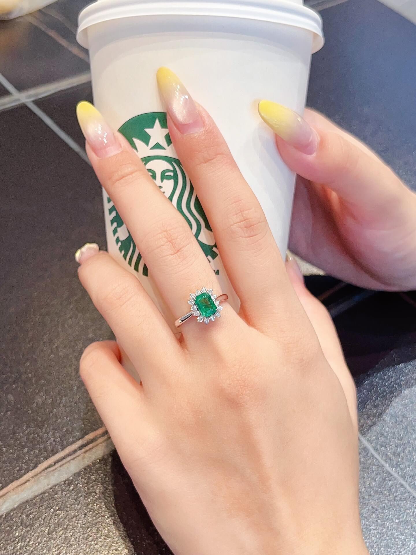 Halo setting lab grown emerald engagement ring