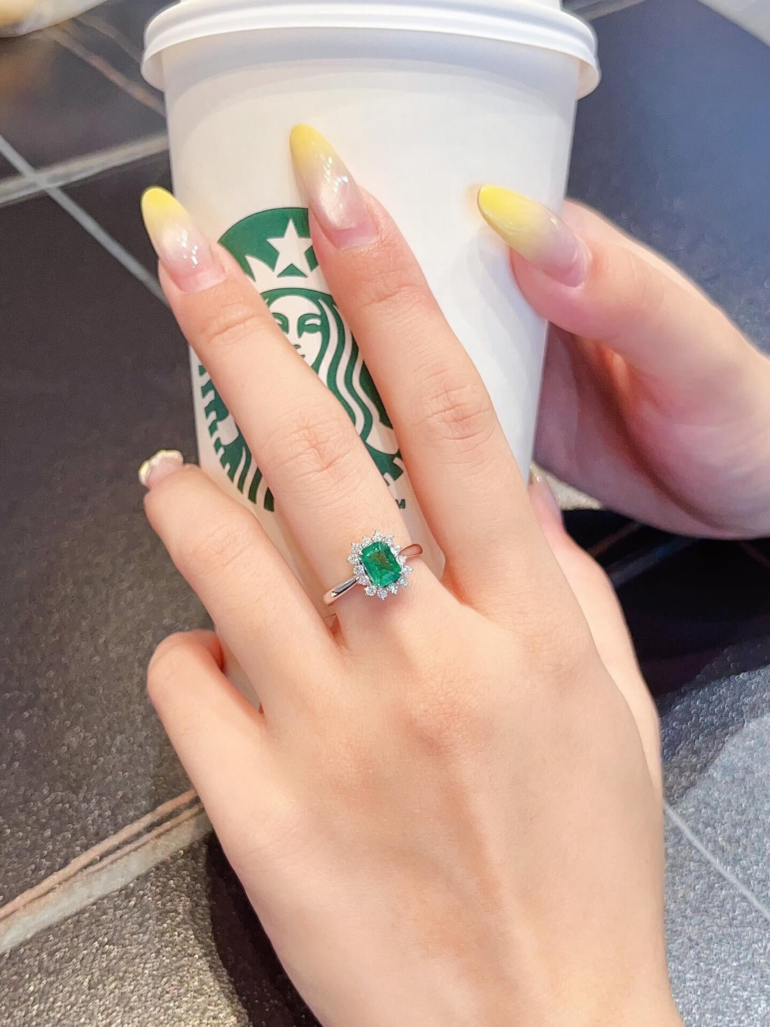 Halo setting lab grown emerald engagement ring