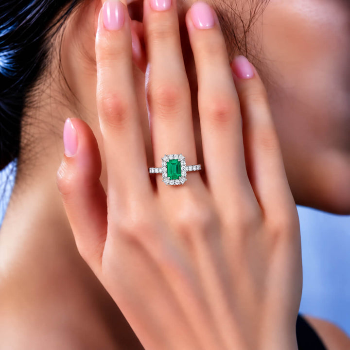 Halo setting lab grown emerald engagement ring