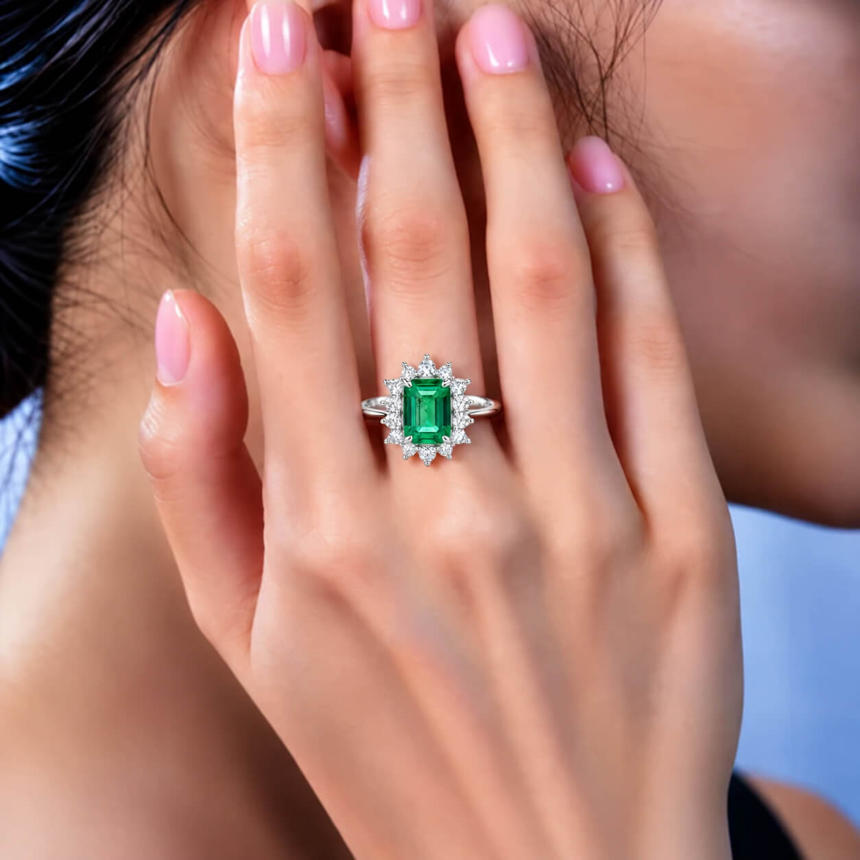 Halo setting lab grown emerald engagement ring