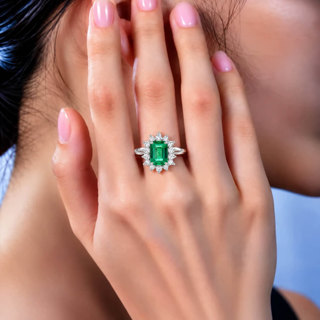 Halo setting lab grown emerald engagement ring