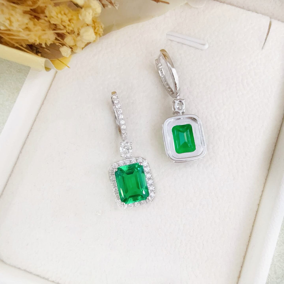 Halo setting lab grown emerald hoop earrings