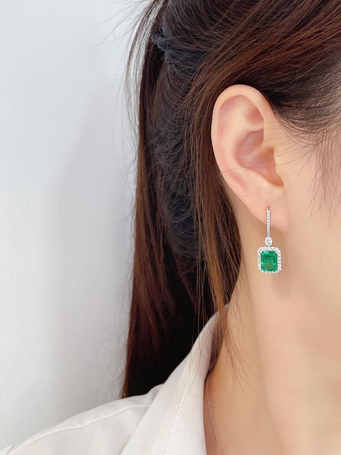 Halo setting lab grown emerald hoop earrings