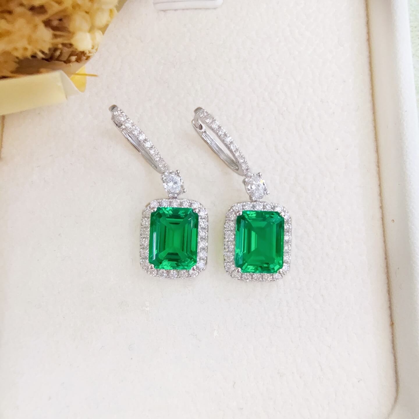 Halo setting lab grown emerald hoop earrings