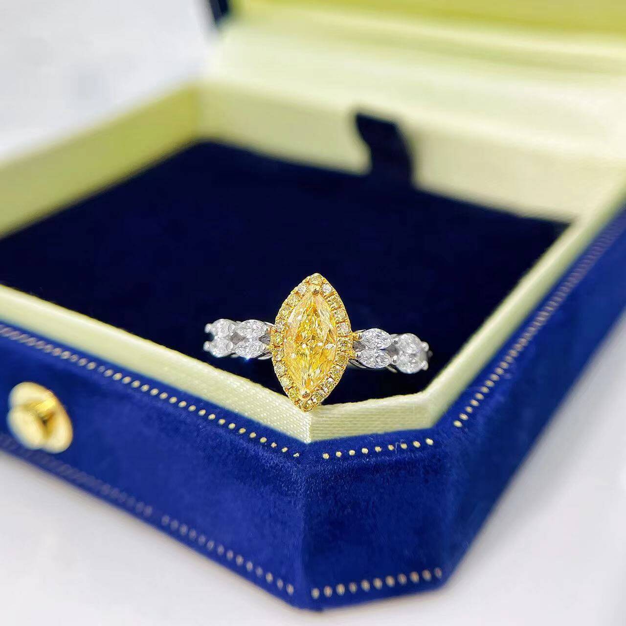 Halo setting marquise cut lab grown yellow diamond engagement ring