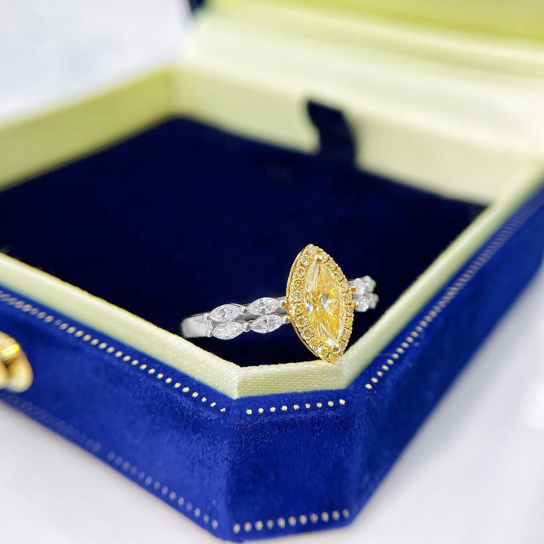 Halo setting marquise cut lab grown yellow diamond engagement ring