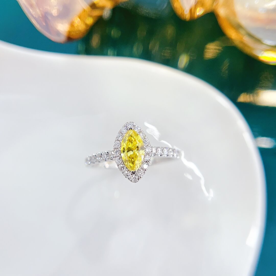 Halo setting marquise cut lab grown yellow diamond engagement ring