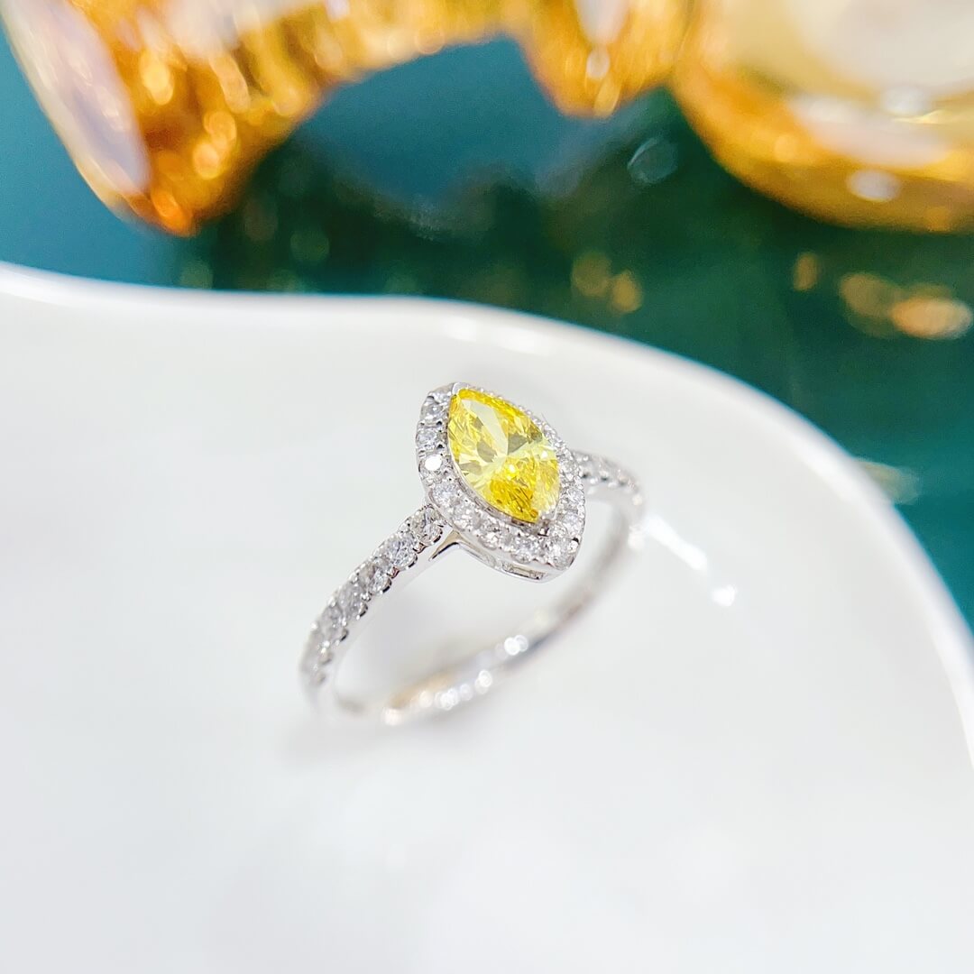 Halo setting marquise cut lab grown yellow diamond engagement ring