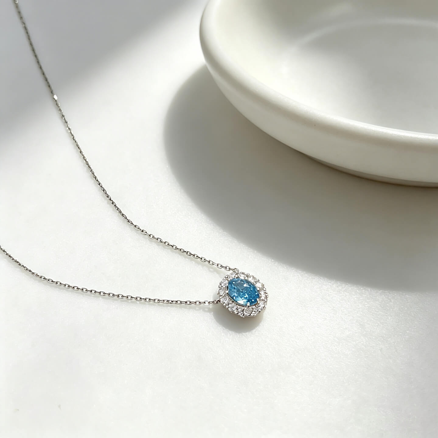 Halo setting oval cut lab grown blue diamond necklace