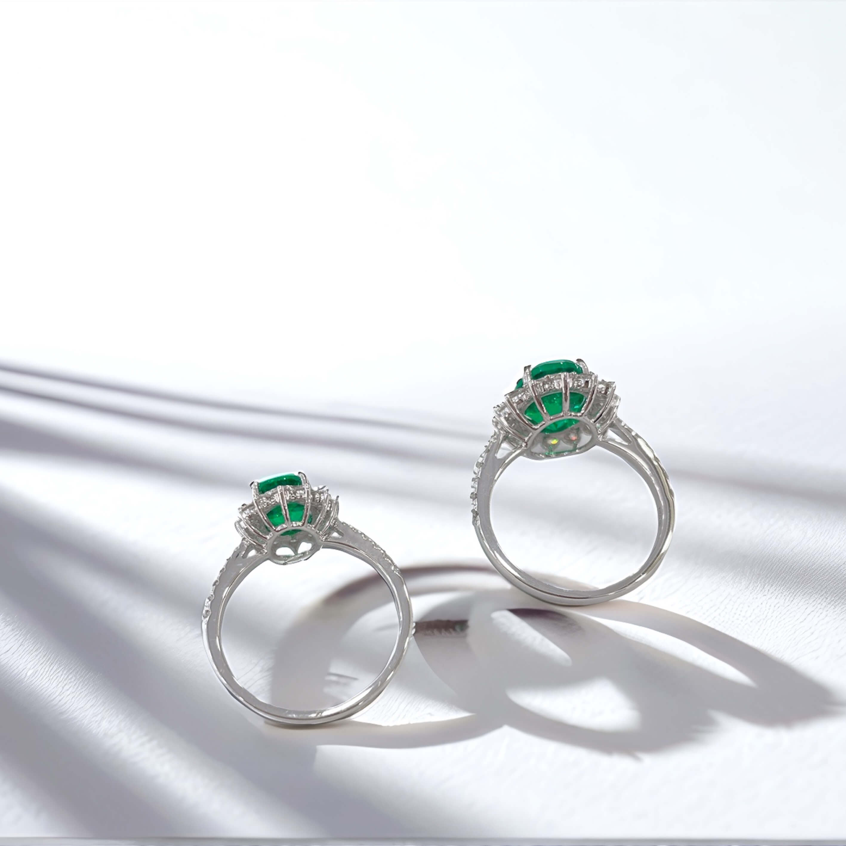Halo setting oval cut lab grown emerald engagement ring