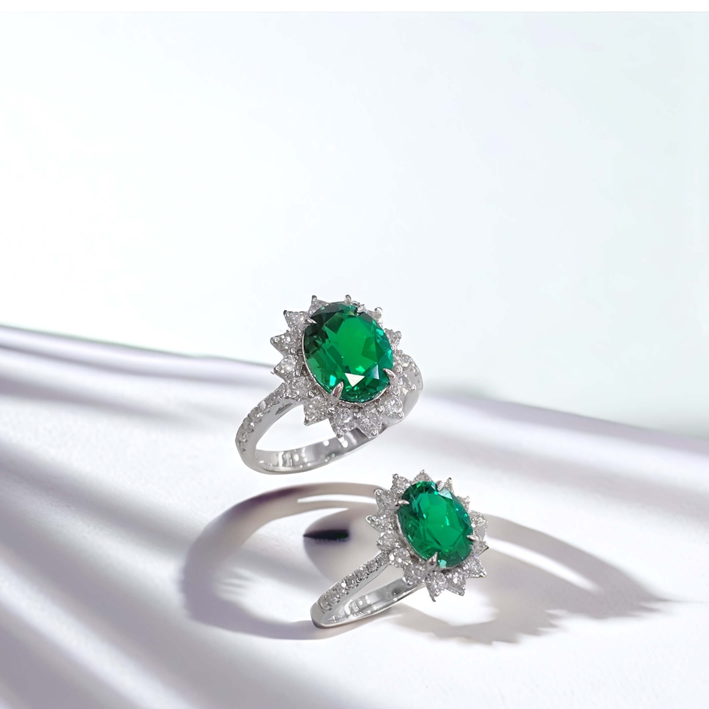 Halo setting oval cut lab grown emerald engagement ring